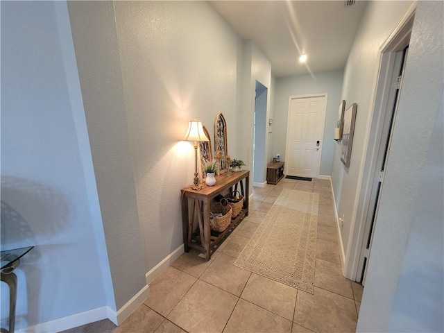 1808 Berkshire Cir SW, Vero Beach, FL 32968 - corridor with light tile patterned floors and baseboards