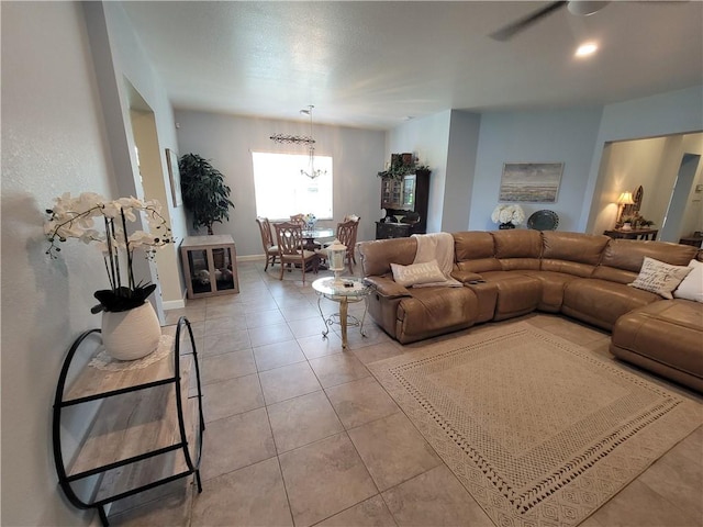 1808 Berkshire Cir SW, Vero Beach, FL 32968 - living room with a chandelier, light tile patterned floors, and ceiling fan