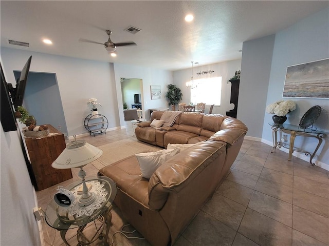 1808 Berkshire Cir SW, Vero Beach, FL 32968 - living room featuring tile patterned flooring, ceiling fan, a chandelier, and recessed lighting