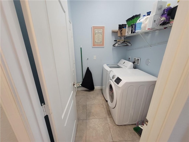 1808 Berkshire Cir SW, Vero Beach, FL 32968 - laundry area featuring washer and clothes dryer and light tile patterned floors