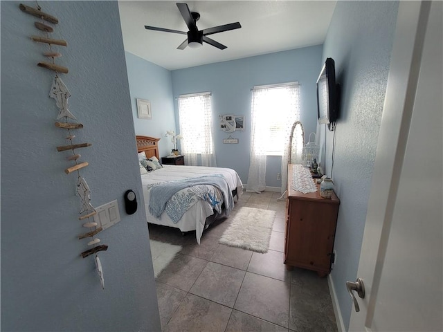 1808 Berkshire Cir SW, Vero Beach, FL 32968 - bedroom featuring ceiling fan, light tile patterned floors, and a textured wall