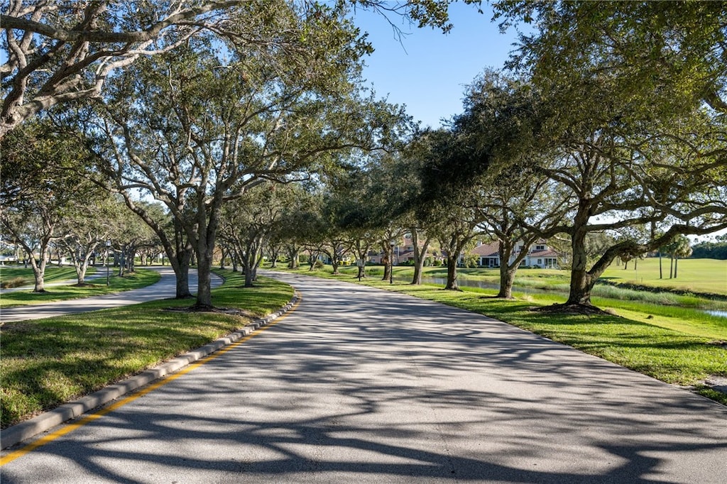 view of property's community with a yard