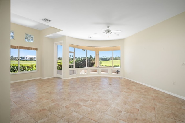 spare room with light tile patterned floors and ceiling fan