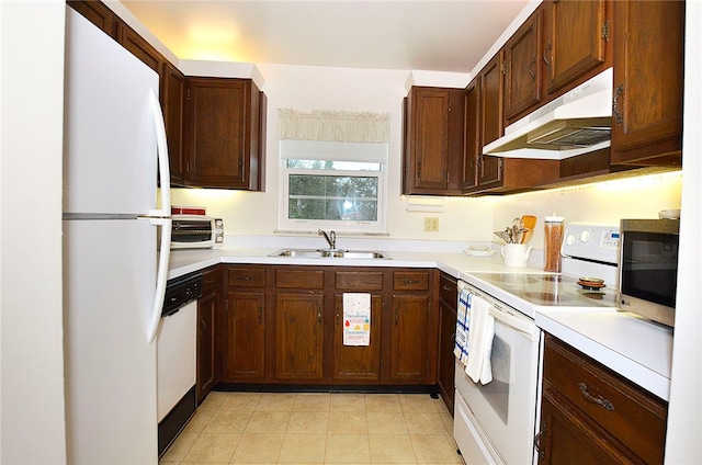 kitchen featuring white appliances and sink