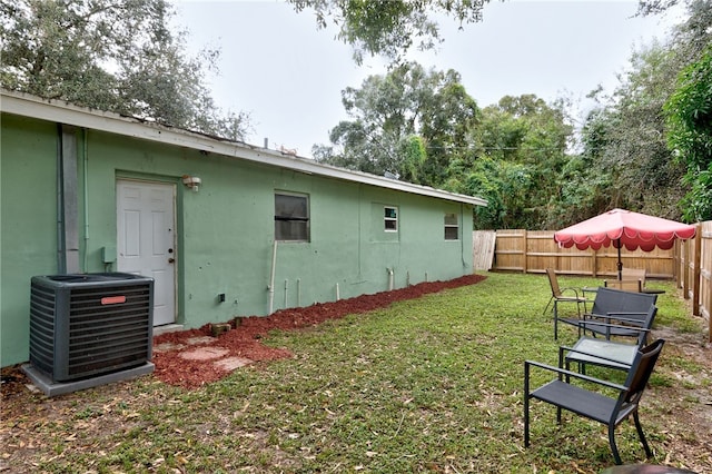 view of yard with central air condition unit