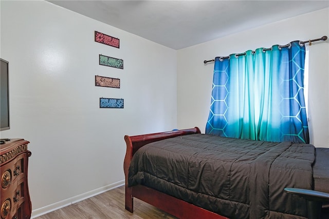 bedroom with wood-type flooring