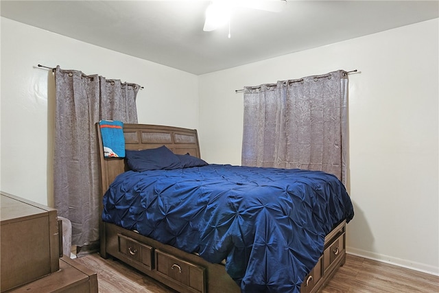 bedroom with hardwood / wood-style flooring and ceiling fan