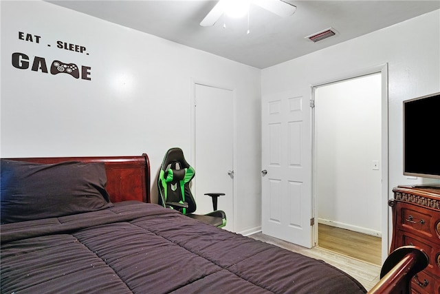 bedroom featuring wood-type flooring and ceiling fan