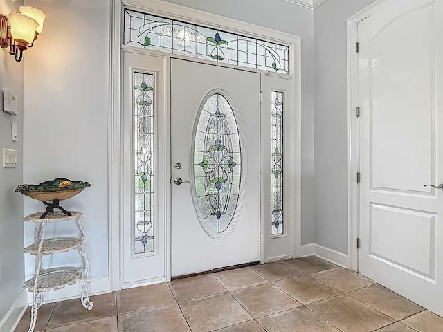 7330 36th Ct, Vero Beach, FL 32967 - entrance foyer with baseboards and light tile patterned flooring