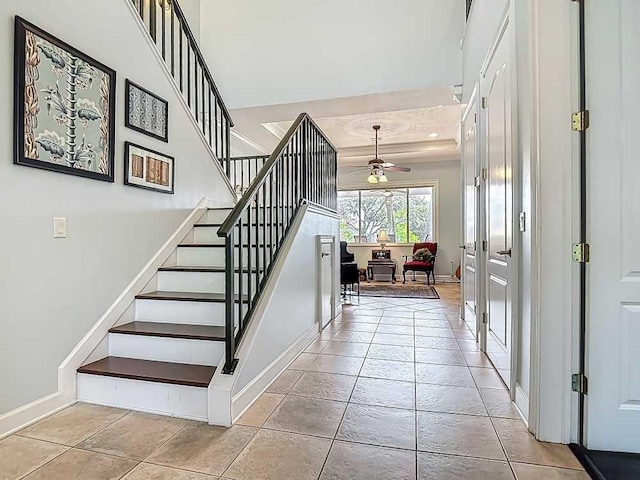 7330 36th Ct, Vero Beach, FL 32967 - stairs with a ceiling fan, baseboards, and tile patterned floors