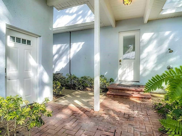7330 36th Ct, Vero Beach, FL 32967 - entrance to property featuring a patio and stucco siding
