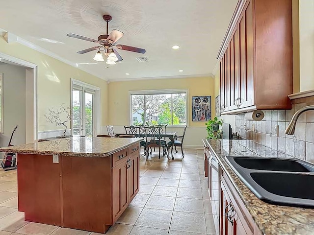 7330 36th Ct, Vero Beach, FL 32967 - kitchen with plenty of natural light, a sink, and light tile patterned floors