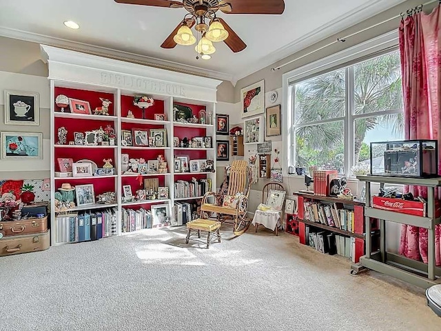 7330 36th Ct, Vero Beach, FL 32967 - sitting room with crown molding, a ceiling fan, and carpet flooring