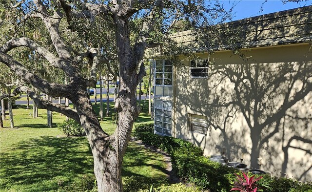 view of side of home featuring a yard