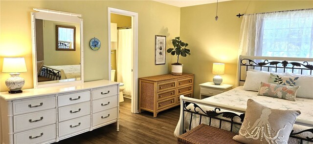 bedroom featuring dark hardwood / wood-style flooring