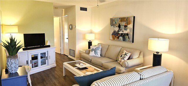 living room with dark wood-type flooring