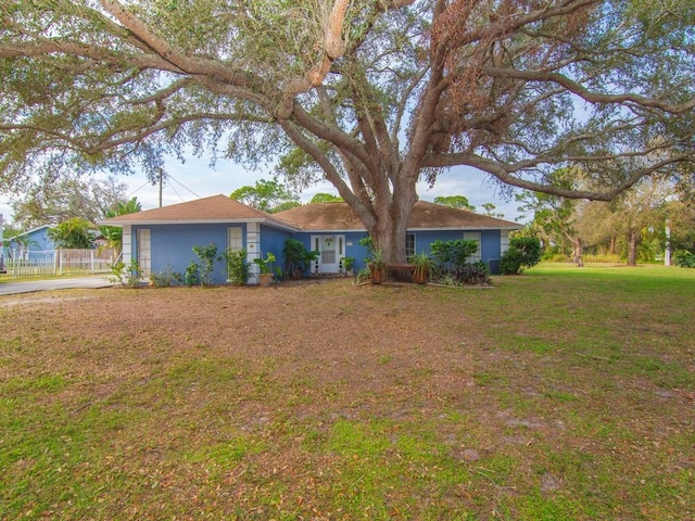 single story home with a front yard