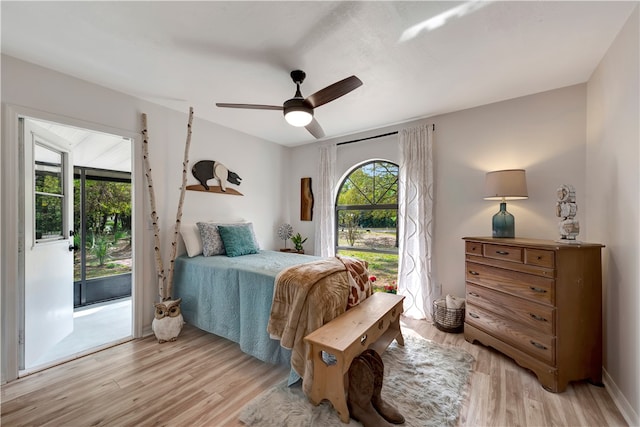 bedroom with ceiling fan, access to exterior, and light hardwood / wood-style floors