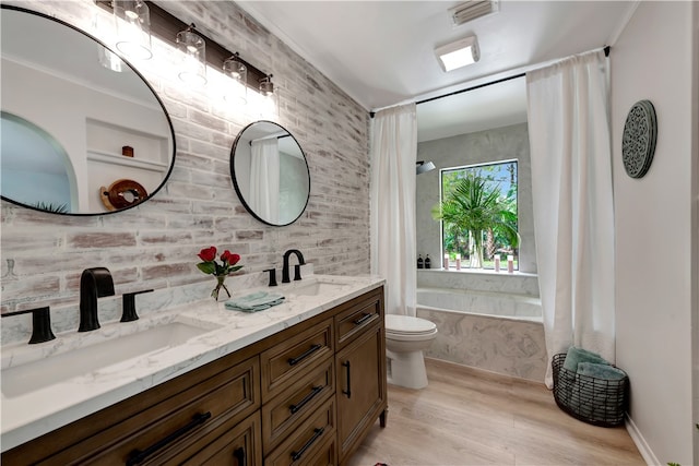 full bathroom featuring toilet, vanity, shower / bath combination with curtain, and hardwood / wood-style flooring