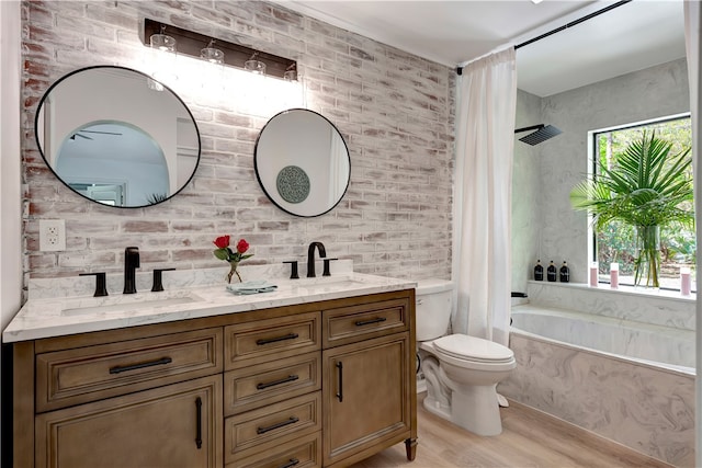 bathroom with toilet, vanity, and hardwood / wood-style floors