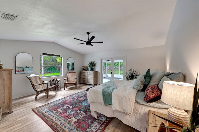 bedroom featuring access to outside, lofted ceiling, ceiling fan, and light hardwood / wood-style floors