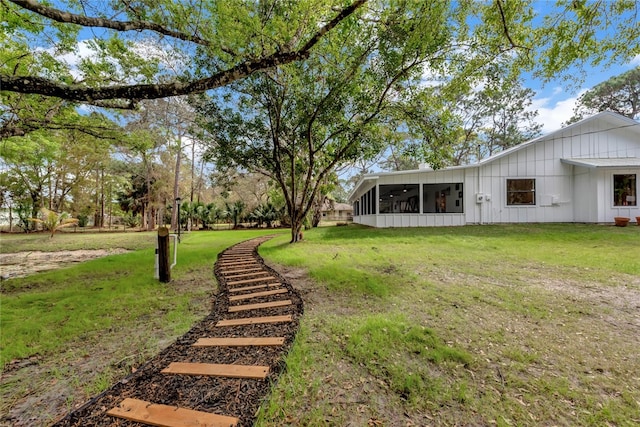 view of yard featuring a sunroom