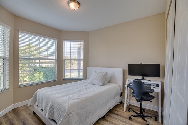 bedroom with light wood-type flooring