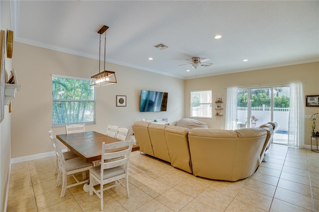 tiled living room featuring ceiling fan and crown molding