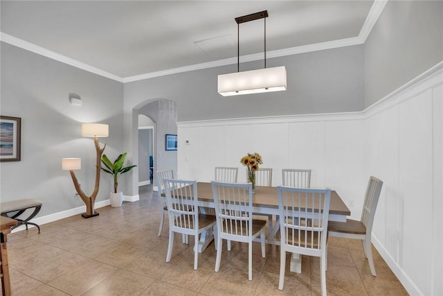 tiled dining area with a wall mounted AC and crown molding