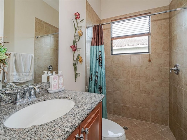 bathroom featuring curtained shower, vanity, and toilet