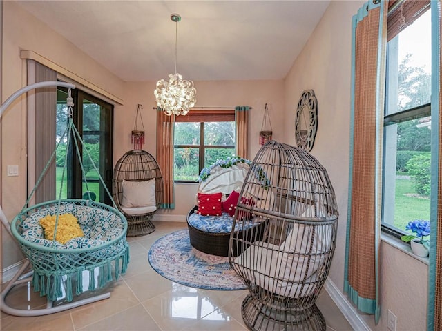 interior space with tile patterned floors and a notable chandelier