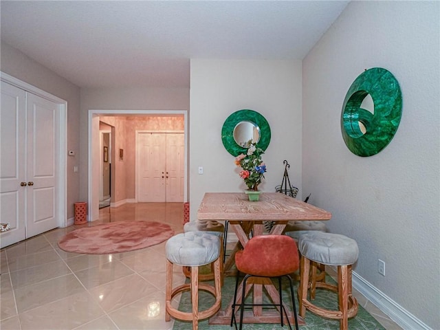 view of tiled dining space