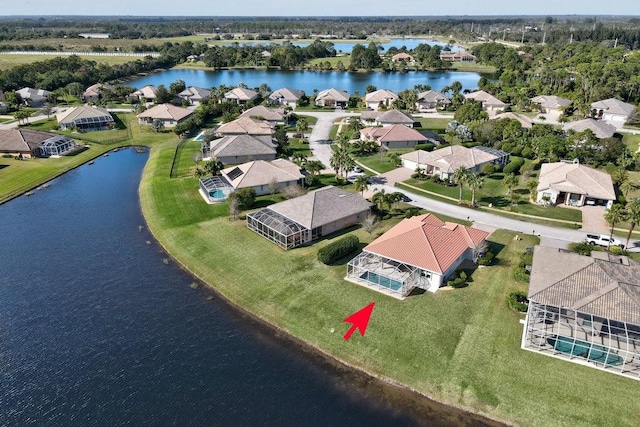 birds eye view of property featuring a water view