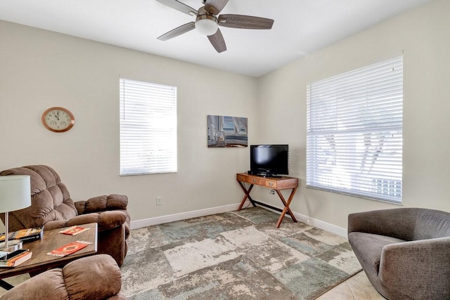 sitting room featuring ceiling fan and light tile patterned flooring