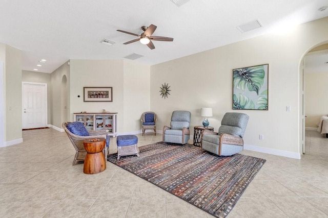 sitting room with light tile patterned floors and ceiling fan