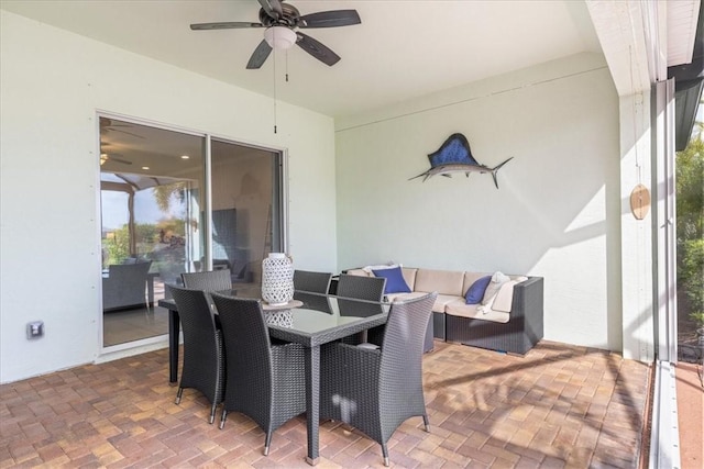 sunroom / solarium featuring ceiling fan