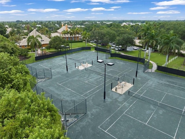 surrounding community featuring tennis court