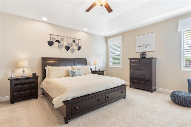 bedroom featuring ceiling fan and light colored carpet