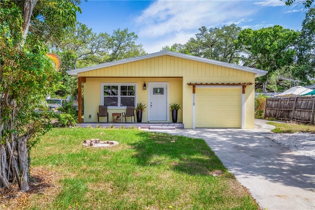 view of front of home featuring a garage and a front lawn