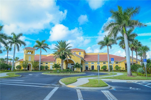 view of property featuring uncovered parking