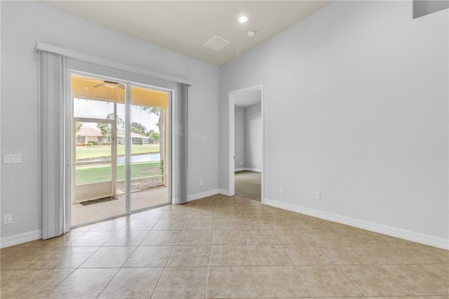 unfurnished room with baseboards, light tile patterned flooring, and visible vents