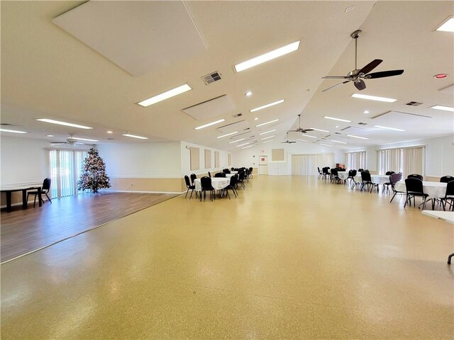 interior space with ceiling fan