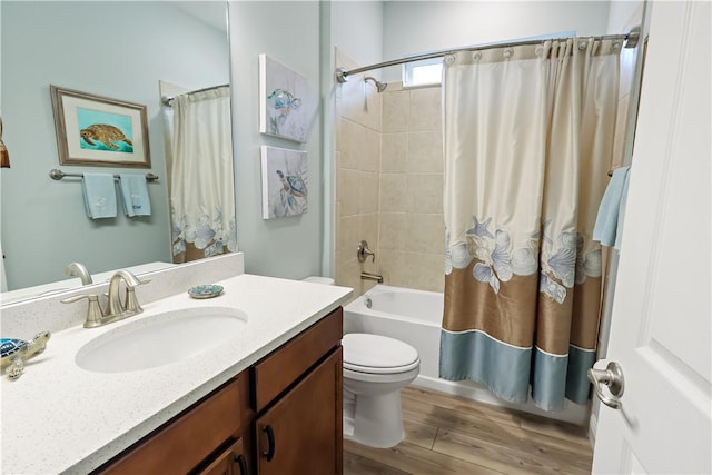 full bathroom with wood-type flooring, vanity, shower / bathtub combination with curtain, and toilet