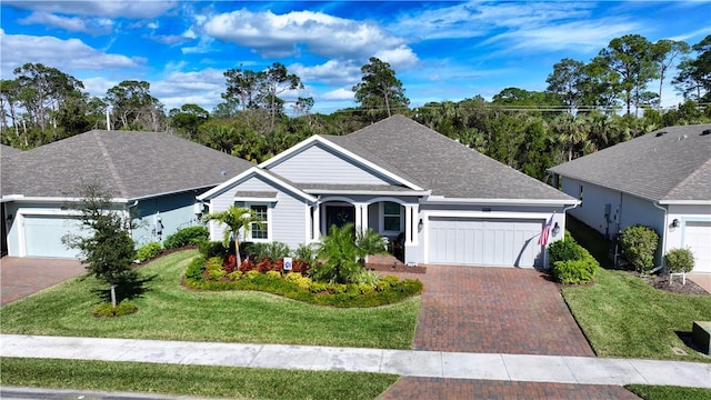 ranch-style home with a garage and a front yard