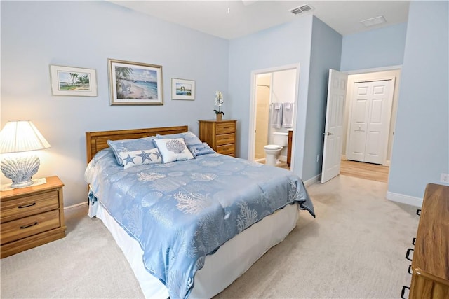 carpeted bedroom featuring connected bathroom
