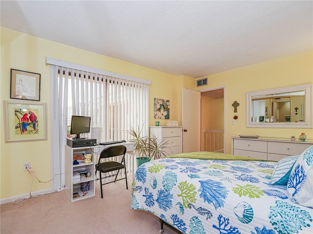 bedroom featuring light carpet