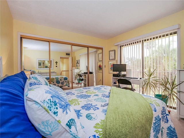 bedroom featuring carpet and a closet