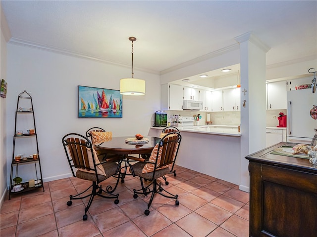 tiled dining room with crown molding