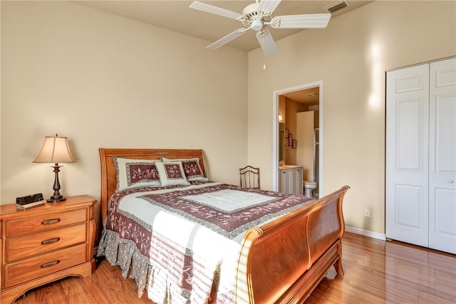 bedroom with ceiling fan, light hardwood / wood-style flooring, and a closet