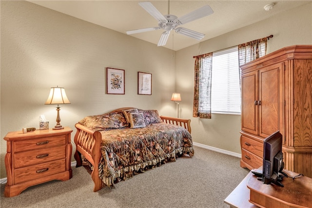 bedroom with ceiling fan and carpet floors